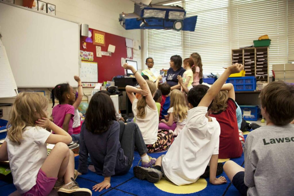 School classroom of young children and teacher.