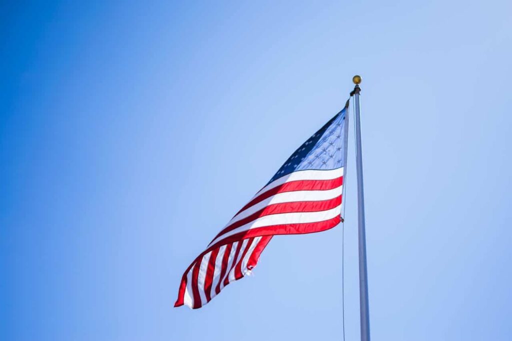 American flag against a blue sky.