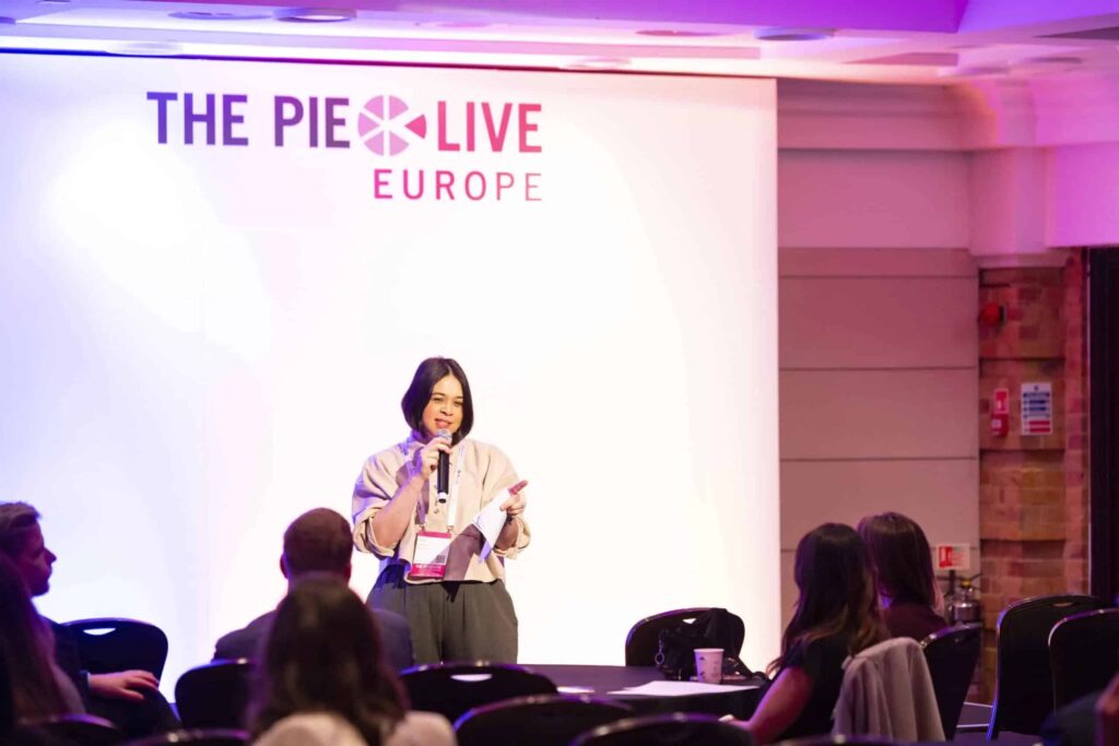 English UK chief executive Jodie Gray speaking at a conference.