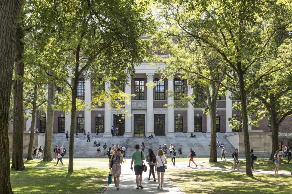College students walking on Harvard University campus.