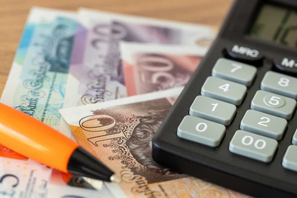 Calculator and British pounds.